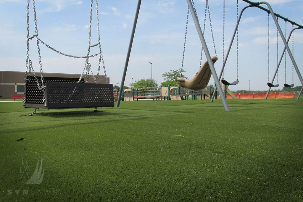 image of leawood kansas City swing set with fake turf