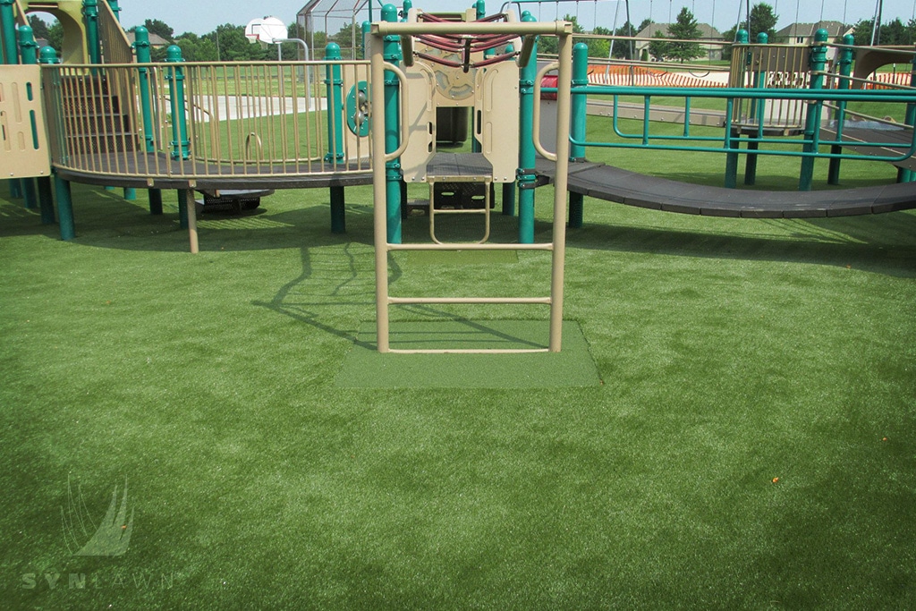image of kansas city monkey bars with safe artificial grass