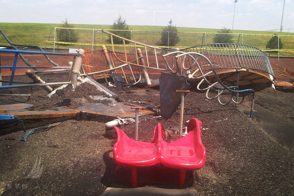 image of cedar hills elementary playground equipment with double red slide burned down