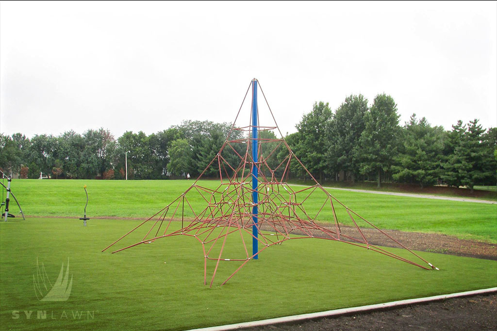 image of  lee’s summit playground climbing equipment on artificial grass
