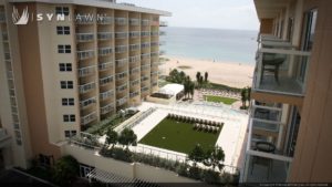 SYNLawn artificial grass commercial beach resort hotel roof by ocean
