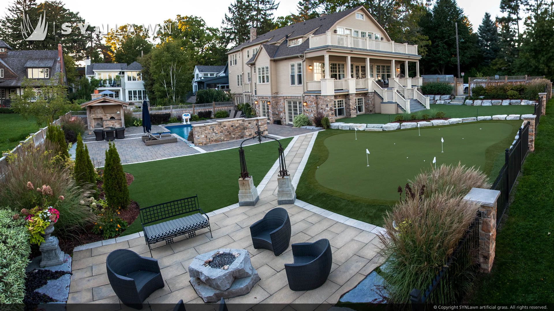 SYNLawn artificial grass residential backyard landscape with putting green