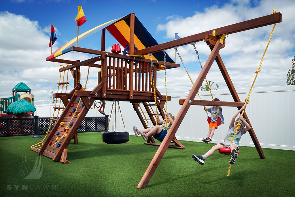 image of kids playing on a backyard swing set