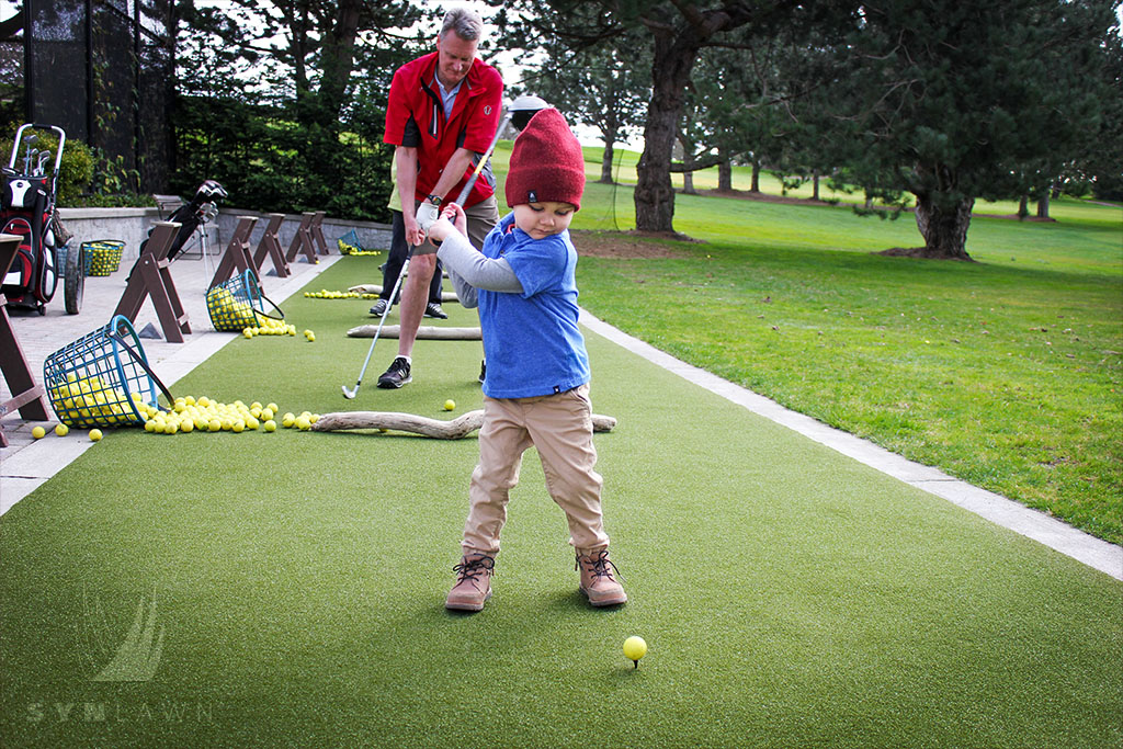 image of a kid playing golf