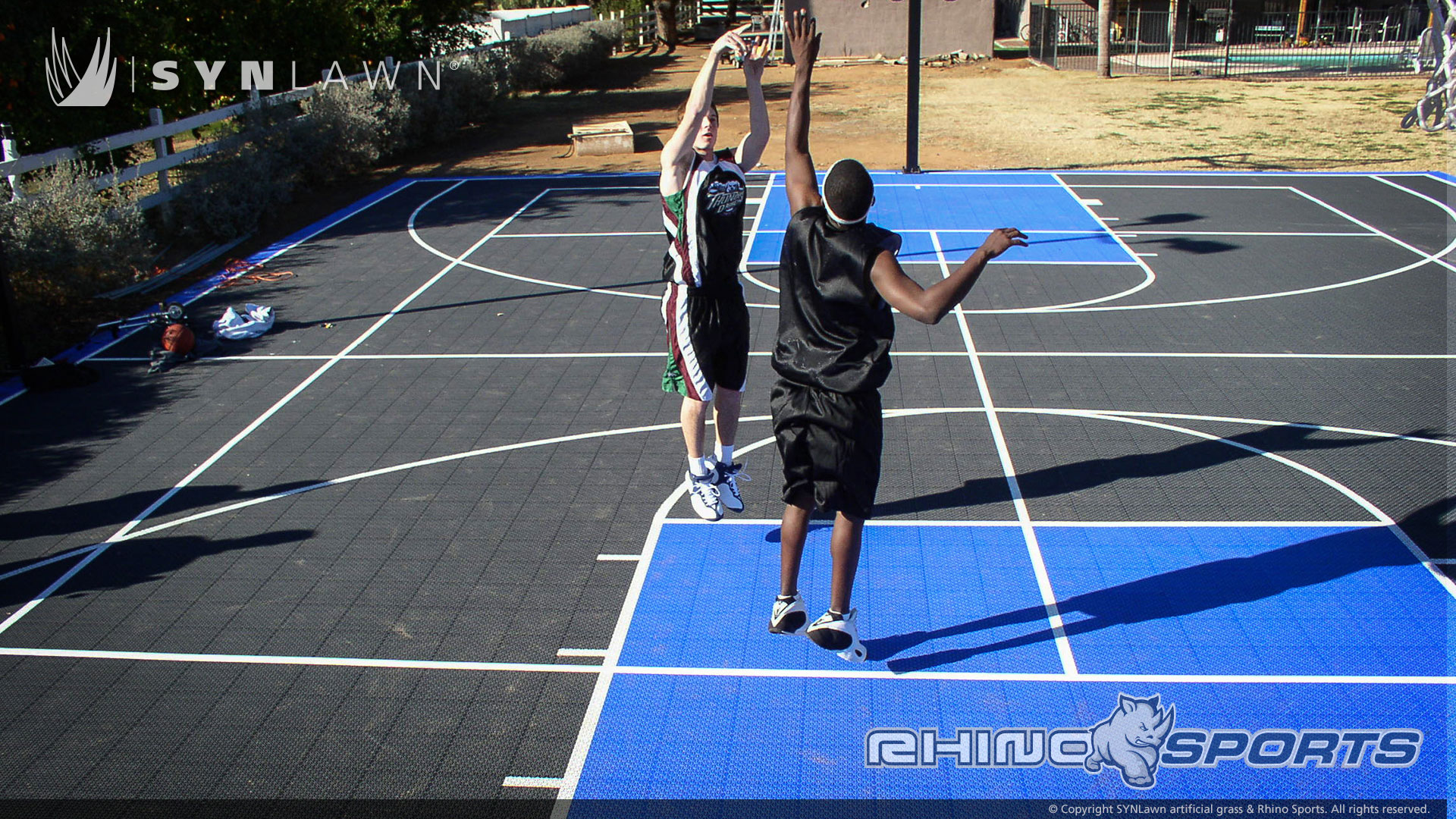 image of boys playing basketball on backyard bball court