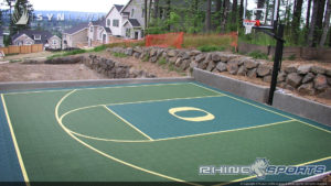 residential backyard basketball court system with custom logo