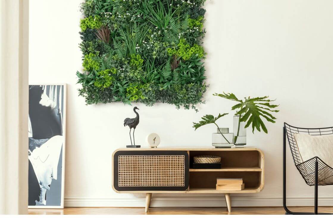 CalicoGreens_Wall_2 Green artificial wall panel with behind a desk with a plant