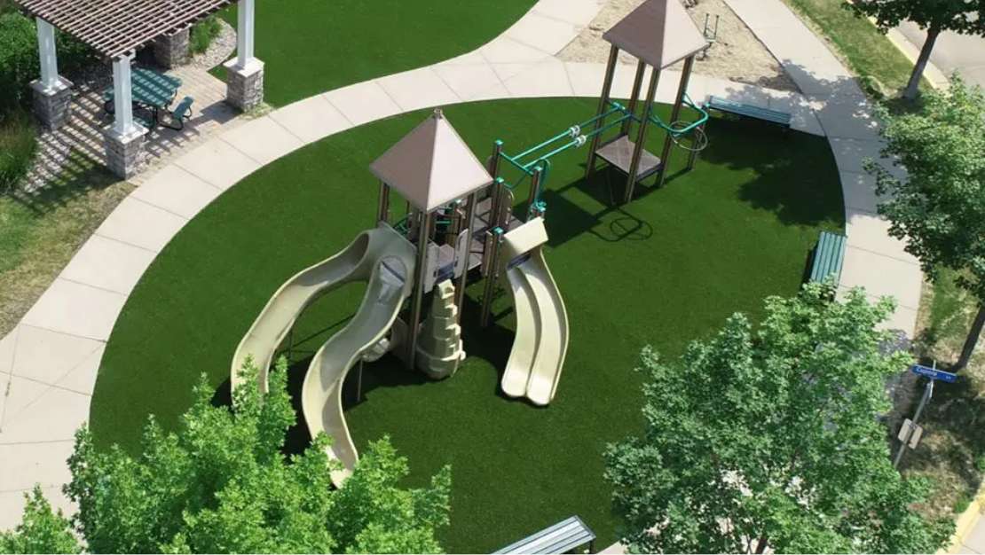 Playground_After_v1 Aerial view of the playground with green artificial turf surfacing