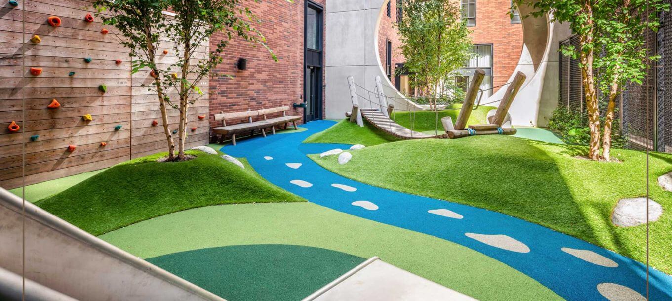Synlawn_pouredinplace_outdoorspace_1 Outdoor space with artificial turf and poured in place blue path