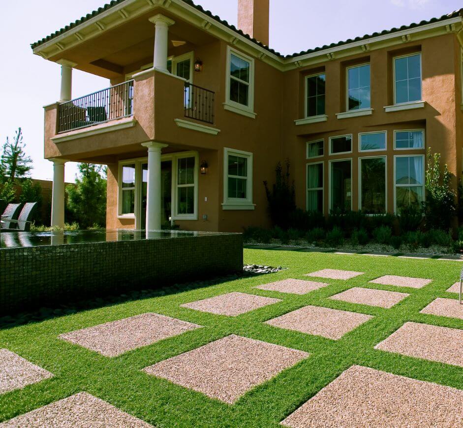 Synstone_300 A grid of synstone rectangles within a large artificial grass area
