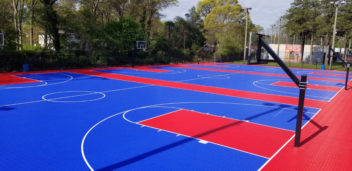 Red and blue SYNCourt with basketball hoop