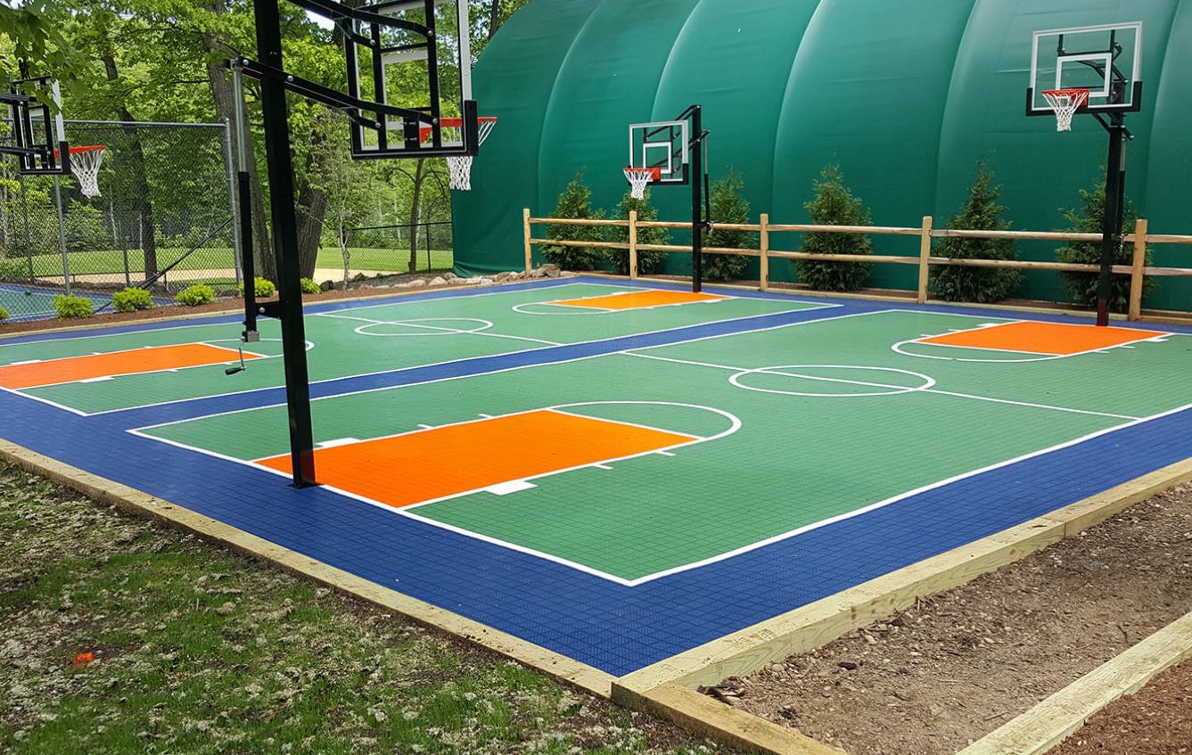 Outdoor court surfacing with basketball hoops