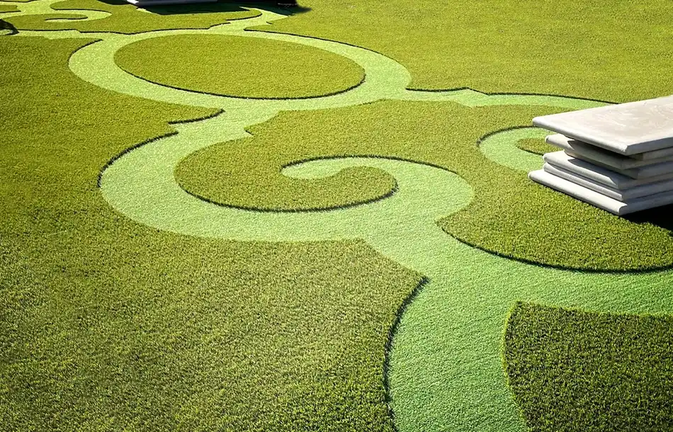 custom-designed-pre-fabricated-projects-by-synlawn backyard with patterns in the artificial grass and a pool